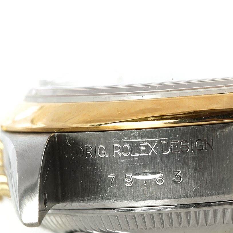 This image shows a close-up side view of the Rolex Datejust 79163 Women's Steel and Gold (two tone) Black Dial 79163 Women's Steel and Gold (two tone) Black Dial model, highlighting the casing with engraved model number.