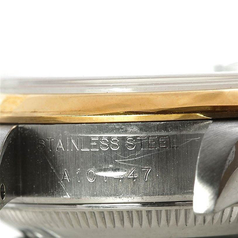 This image displays a close-up of the stainless steel side and partial bezel of a Rolex Datejust 79163 Women's Steel and Gold (two tone) Black Dial 79163 Women's Steel and Gold (two tone) Black Dial watch.