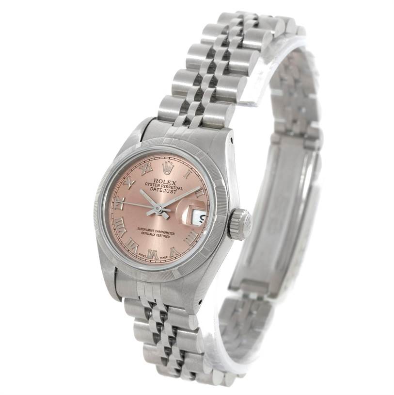 The Rolex Datejust 69190 Women's Stainless Steel Pink Dial 69190 Women's Stainless Steel Pink Dial watch is shown at an angle displaying the face, bezel, crown, and part of the bracelet.