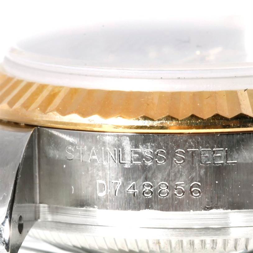 The image shows a close-up of the side of a Rolex Datejust 179173 Women's Steel and Gold (two tone) Mother of Pearl Dial 179173 Women's Steel and Gold (two tone) Mother of Pearl Dial watch, highlighting the stainless steel body and part of the gold bezel.