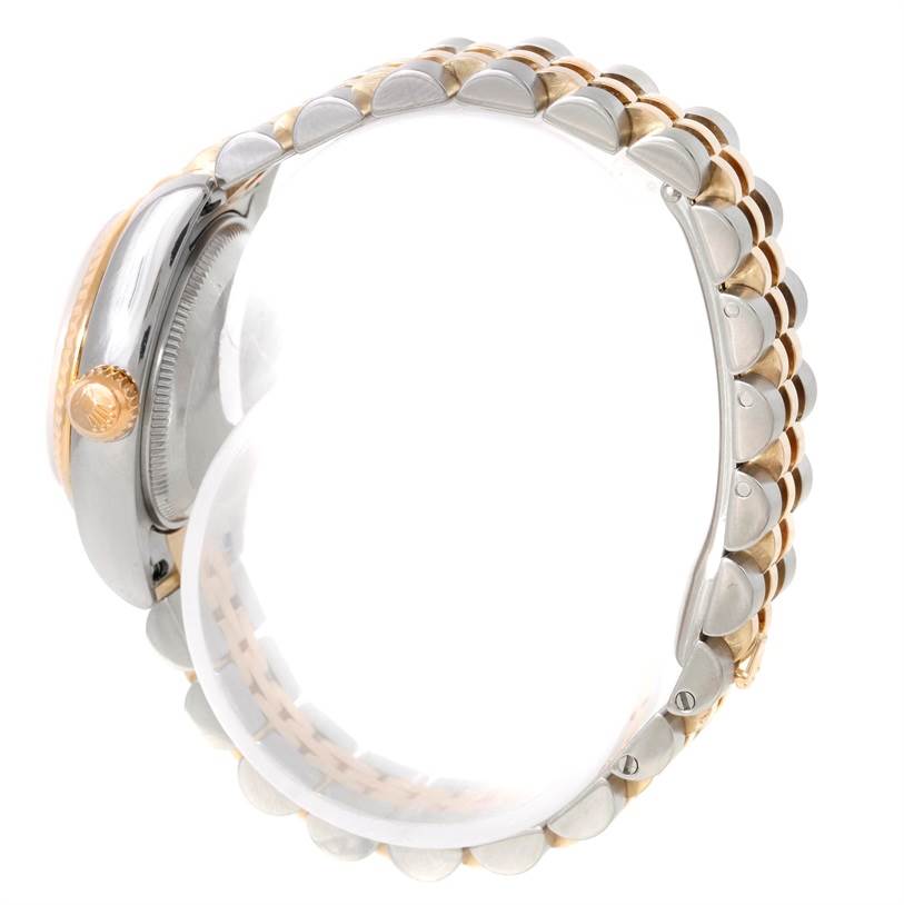 This image shows a side view of the Rolex Datejust 179173 Women's Steel and Gold (two tone) Mother of Pearl Dial 179173 Women's Steel and Gold (two tone) Mother of Pearl Dial watch, highlighting the crown and the bracelet.