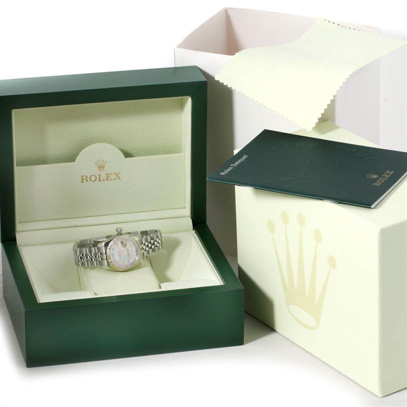 The image shows a Rolex Datejust 179174 Women's Stainless Steel Mother of Pearl Dial 179174 Women's Stainless Steel Mother of Pearl Dial watch in its box with accompanying manuals and cleaning cloth.