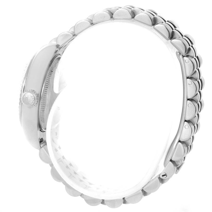 This is a side view of the Rolex Datejust 179174 Women
s Stainless Steel Black Dial 179174 Women
s Stainless Steel Black Dial watch, showing the crown and bracelet links.