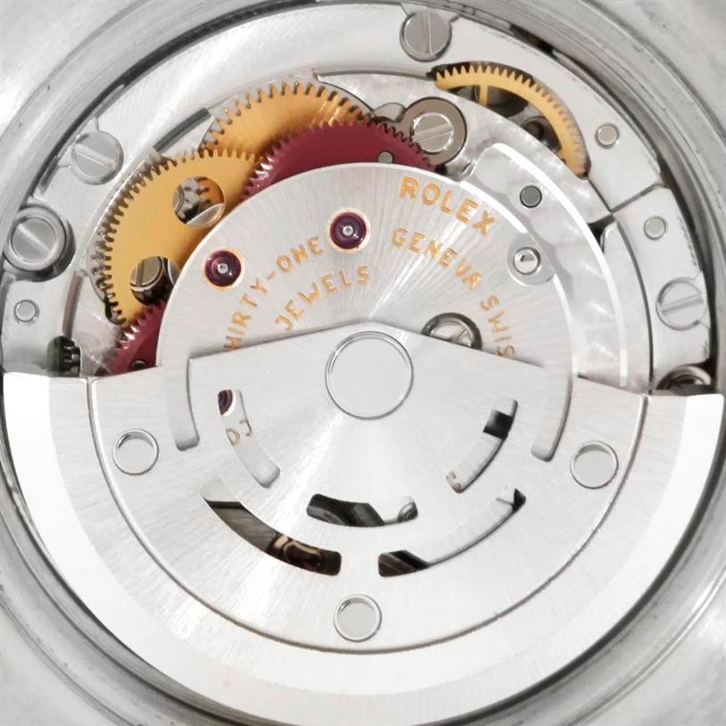 This is a close-up view of the movement mechanism of a Rolex Datejust 179174 Women
s Stainless Steel Black Dial 179174 Women
s Stainless Steel Black Dial watch, showcasing gears and the rotor.