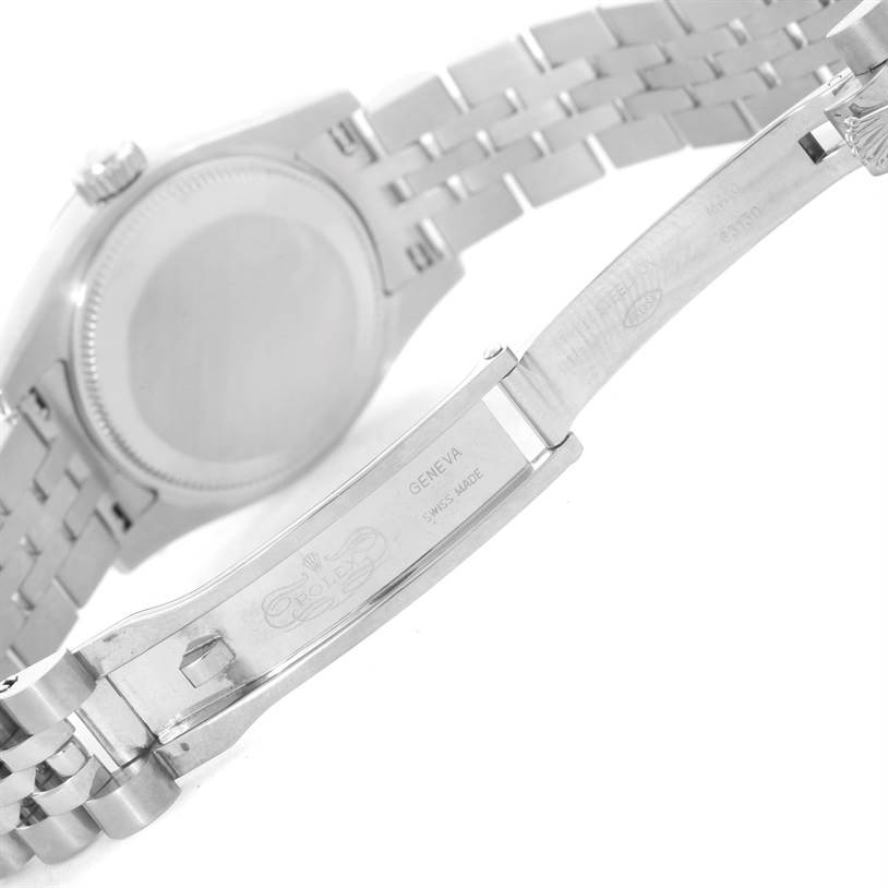 The image shows the back case and the inside of the clasp of a Rolex Datejust 179174 Women
s Stainless Steel Black Dial 179174 Women
s Stainless Steel Black Dial watch, showcasing the bracelet and clasp engravings.