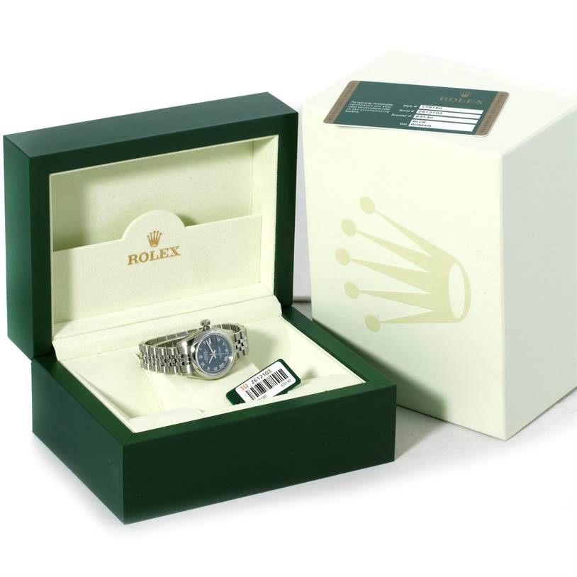The image shows a Rolex Datejust 179160 Women's Stainless Steel Blue Dial 179160 Women's Stainless Steel Blue Dial watch inside its open green box, with an outer packaging box nearby.