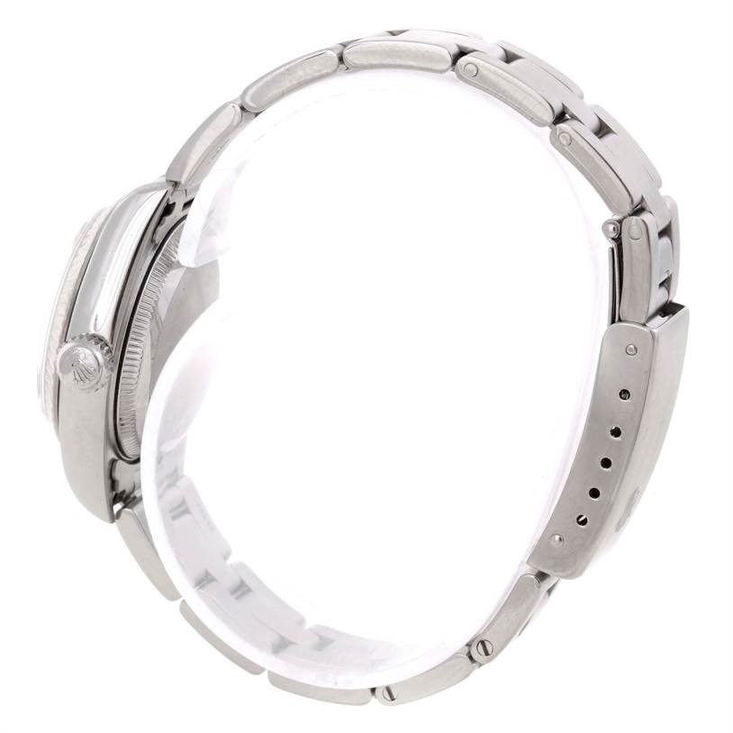 This image shows a side profile of a Rolex Datejust 69174 Women's Stainless Steel Silver Dial 69174 Women's Stainless Steel Silver Dial watch, focusing on the bracelet and crown.