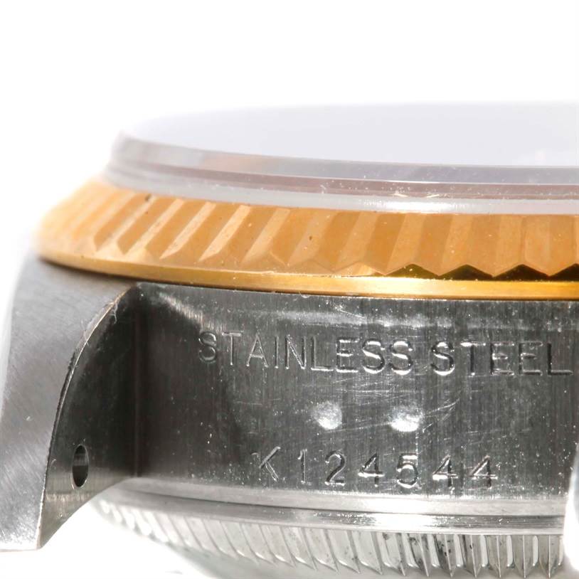 The image shows a close-up of the side of a Rolex Datejust 79173 Women
s Stainless Steel Silver Dial 79173 Women
s Stainless Steel Silver Dial, emphasizing the stainless steel case and bezel.