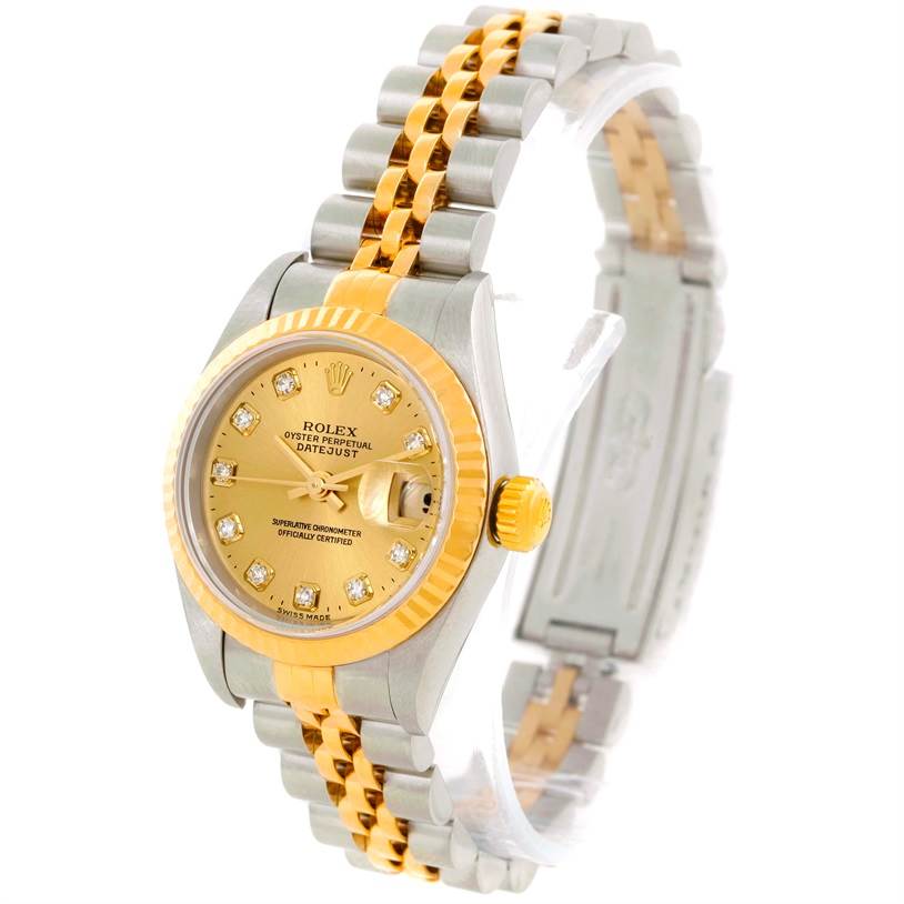 The image shows a Rolex Datejust 79173 Men
s Stainless Steel Champagne Dial 79173 Men
s Stainless Steel Champagne Dial watch at a slight angle, displaying its gold and silver bracelet, dial, and bezel.