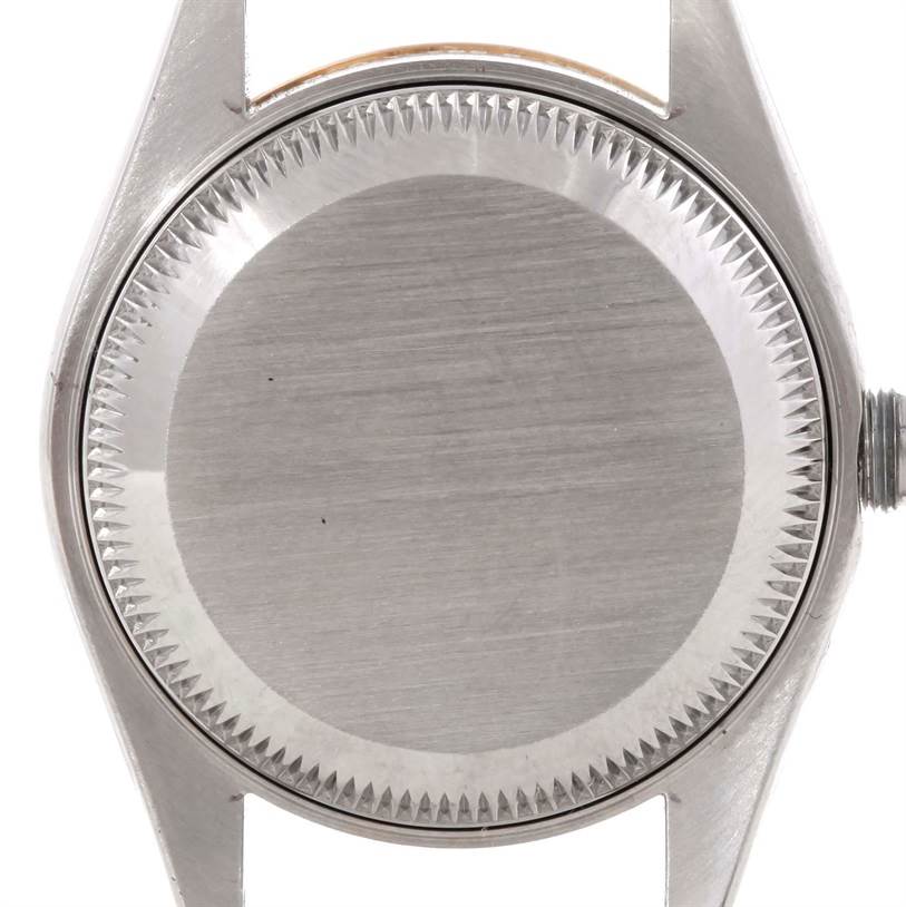 This image shows the back side of a Rolex Datejust 79173 Men
s Stainless Steel Champagne Dial 79173 Men
s Stainless Steel Champagne Dial watch case, highlighting its brushed metal surface and fluted bezel.