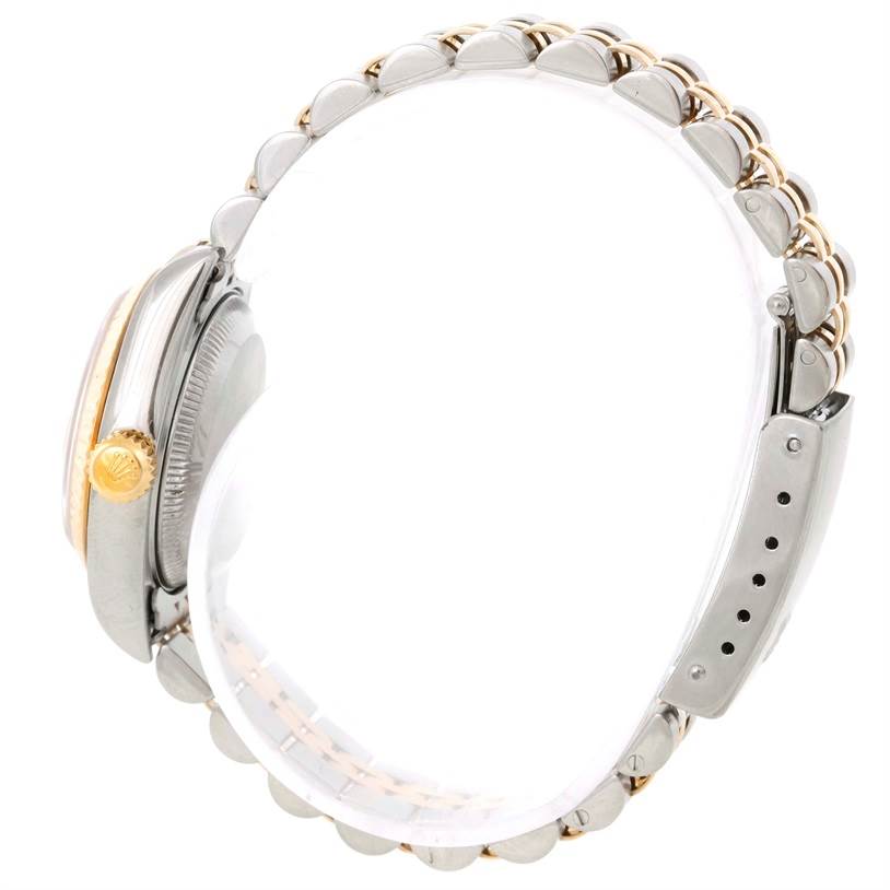 The image shows a side view of a Rolex Datejust 79173 Men
s Stainless Steel Champagne Dial 79173 Men
s Stainless Steel Champagne Dial watch, highlighting the crown, case, and part of the bracelet.