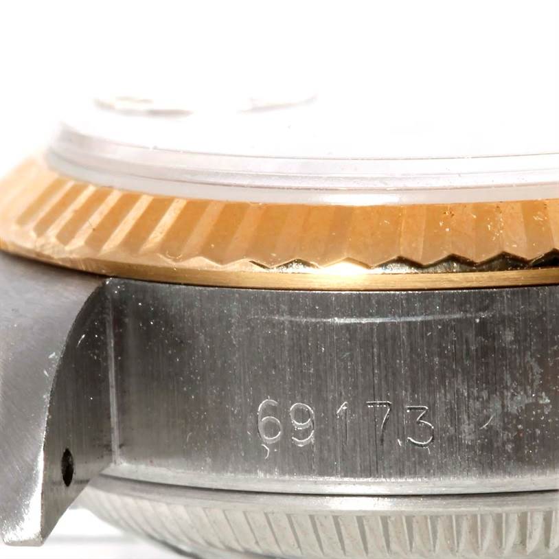 The image shows a side view close-up of the bezel and case of a Rolex Datejust 69173 Women's Stainless Steel Champagne Dial 69173 Women's Stainless Steel Champagne Dial, revealing model number 69173.