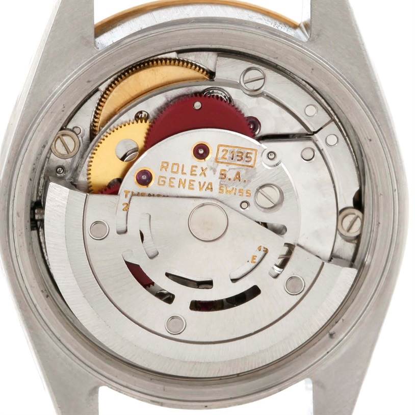 The image shows the movement mechanism of a Rolex Datejust 69173 Women's Stainless Steel Champagne Dial 69173 Women's Stainless Steel Champagne Dial watch, highlighting its intricate gears and components.