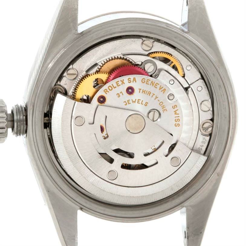 The image shows the internal mechanism, specifically the movement, of a Rolex Datejust 79174 Women's Stainless Steel Pink Dial 79174 Women's Stainless Steel Pink Dial watch.