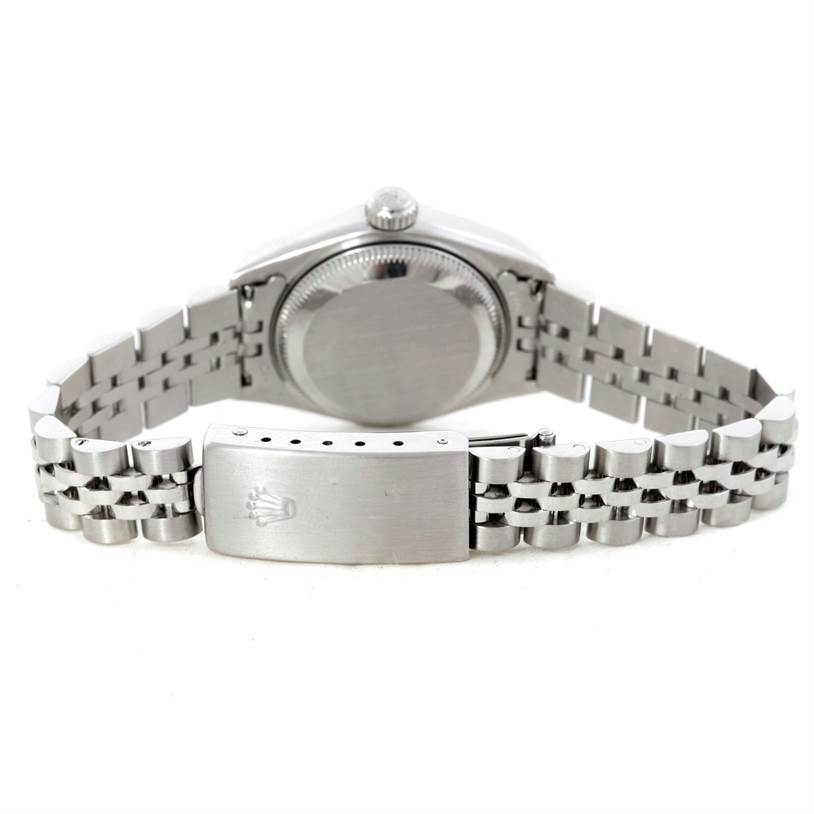 This image shows the backside of the Rolex Datejust 79174 Women's Stainless Steel Pink Dial 79174 Women's Stainless Steel Pink Dial watch, featuring the case back and metal bracelet with a clasp.