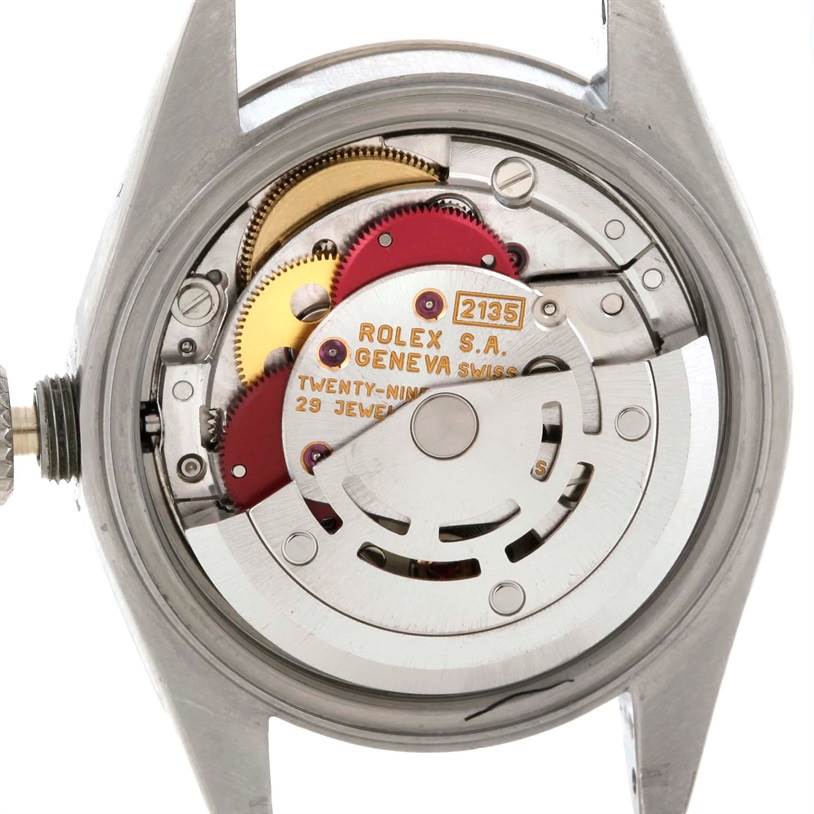 The image shows the inner mechanism of a Rolex Datejust 69174 Women
s Stainless Steel Silver Dial 69174 Women
s Stainless Steel Silver Dial watch, displaying gears and components in a close-up view.