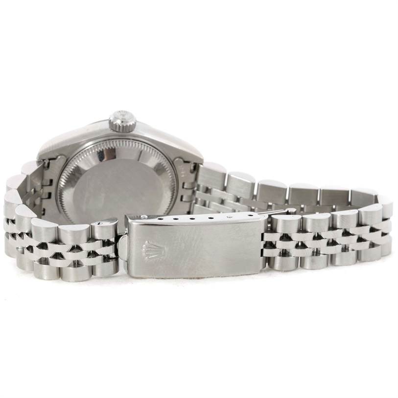 The image shows the back view of a Rolex Datejust 69174 Women
s Stainless Steel Silver Dial 69174 Women
s Stainless Steel Silver Dial watch, highlighting its case back, crown, and Jubilee bracelet with the clasp open.