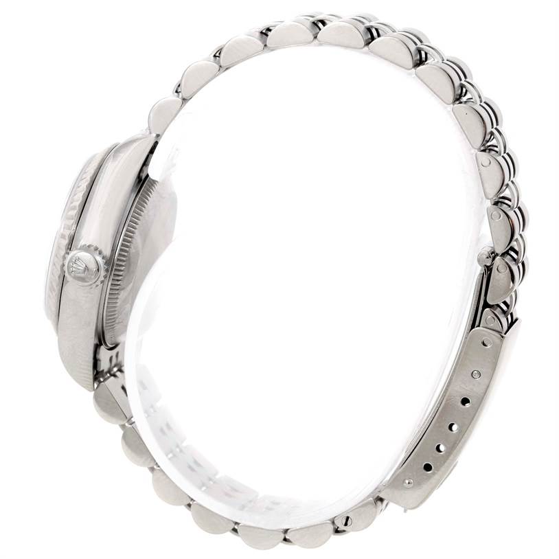 This side-view image of the Rolex Datejust 69174 Women
s Stainless Steel Silver Dial 69174 Women
s Stainless Steel Silver Dial watch highlights its crown, case, and bracelet.
