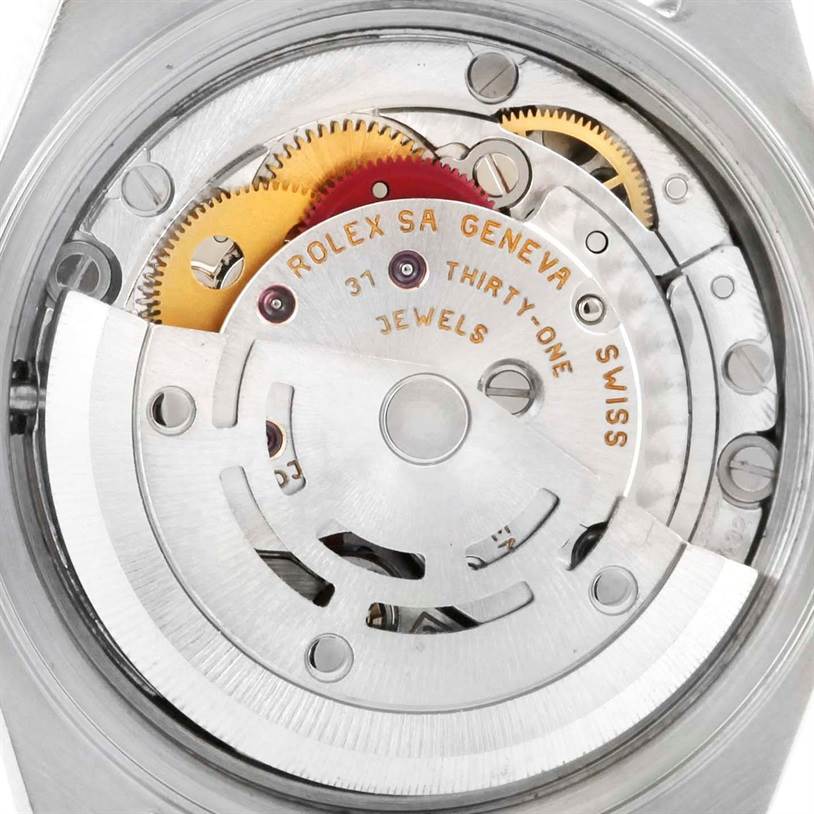 This image shows the intricate internal mechanics and gears of a Rolex Datejust 79174 Women's Stainless Steel Black Dial 79174 Women's Stainless Steel Black Dial watch from its backside.