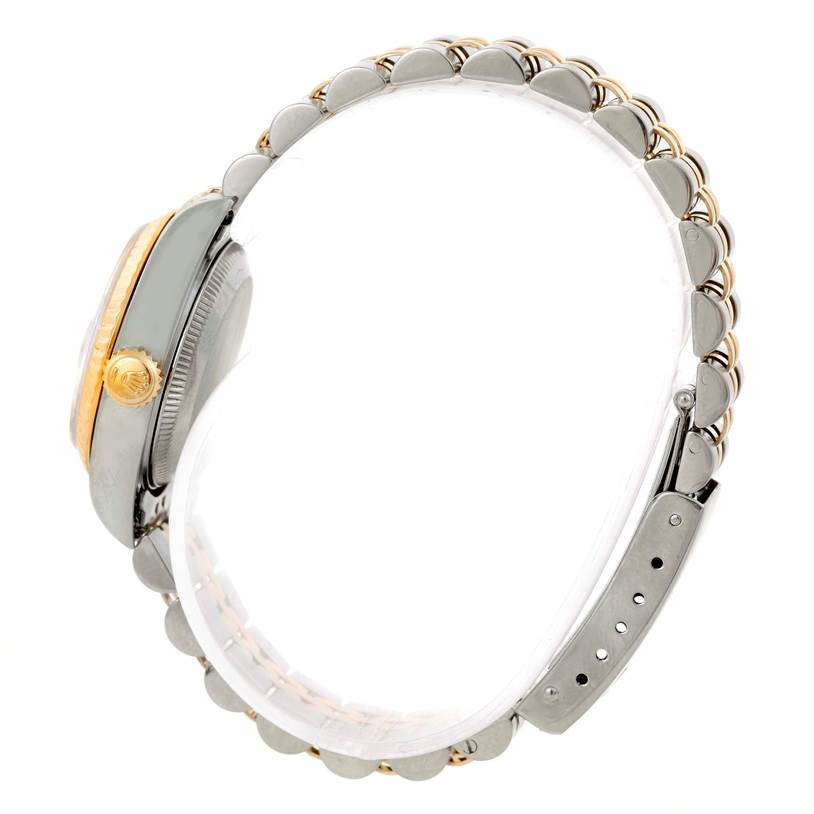 This image shows a side view of a Rolex Datejust 69173 Women's Stainless Steel White Dial 69173 Women's Stainless Steel White Dial watch, highlighting its crown, case, and bracelet clasp.