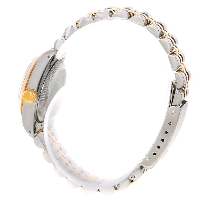 The image shows a side view of a Rolex Datejust 69173 Women's Stainless Steel Black Dial 69173 Women's Stainless Steel Black Dial watch, highlighting its crown, case, and bracelet.