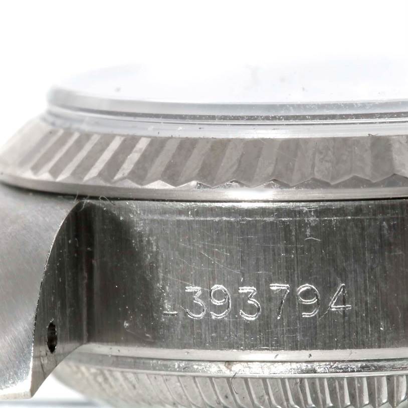 This image shows a close-up view of the side of a Rolex Datejust 69174 Women's Stainless Steel Silver Dial 69174 Women's Stainless Steel Silver Dial watch, highlighting the case and part of the bezel along with the serial number.