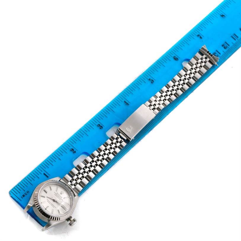 The image shows a Rolex Datejust 69174 Women's Stainless Steel Silver Dial 69174 Women's Stainless Steel Silver Dial watch laying flat next to a ruler, displaying the watch face, bezel, bracelet, and clasp.