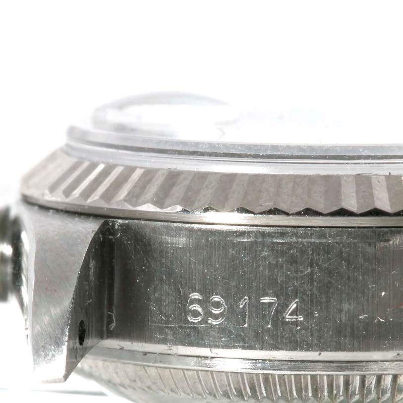 This image shows a close-up side view of the bezel, case, and case number of a Rolex Datejust 69174 Women's Stainless Steel Silver Dial 69174 Women's Stainless Steel Silver Dial watch.