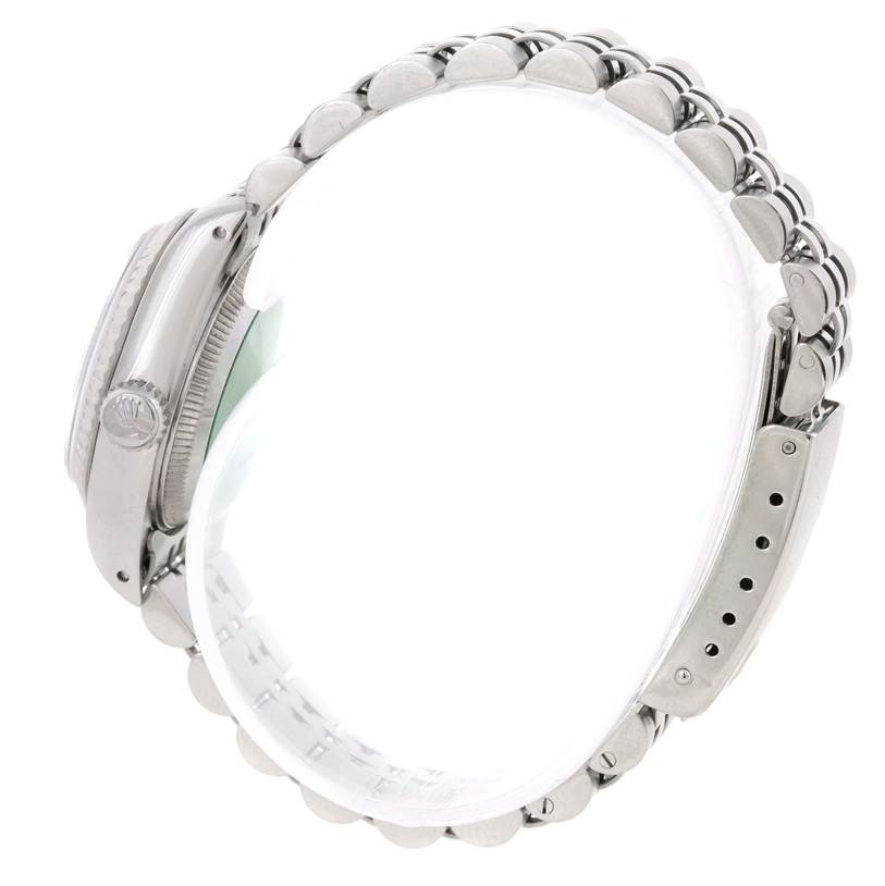 The image shows a side view of a Rolex Datejust 69174 Women's Stainless Steel Silver Dial 69174 Women's Stainless Steel Silver Dial watch, highlighting the crown, case, and bracelet.