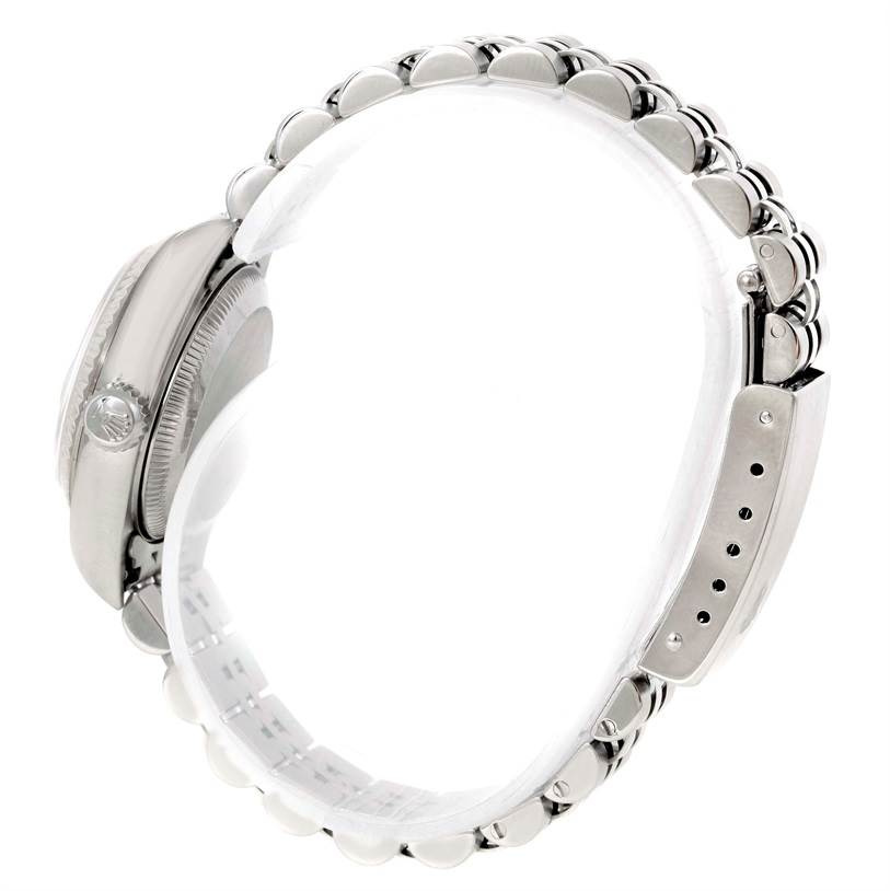 The image shows a side view of the Rolex Datejust 79174 Women's Stainless Steel Silver Dial 79174 Women's Stainless Steel Silver Dial watch, highlighting its crown, bezel, and bracelet links.