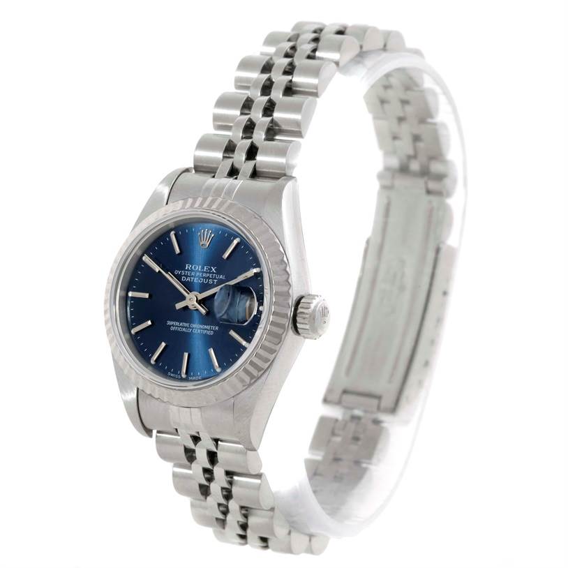 The image shows a Rolex Datejust 79174 Women's Stainless Steel Blue Dial 79174 Women's Stainless Steel Blue Dial watch at an angled view, highlighting its blue dial, silver bracelet, and crown.