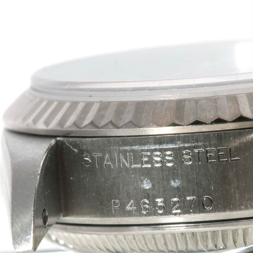 The image shows a close-up side view of the casing and bezel of a Rolex Datejust 79174 Women's Stainless Steel Blue Dial 79174 Women's Stainless Steel Blue Dial watch, highlighting the stainless steel material.