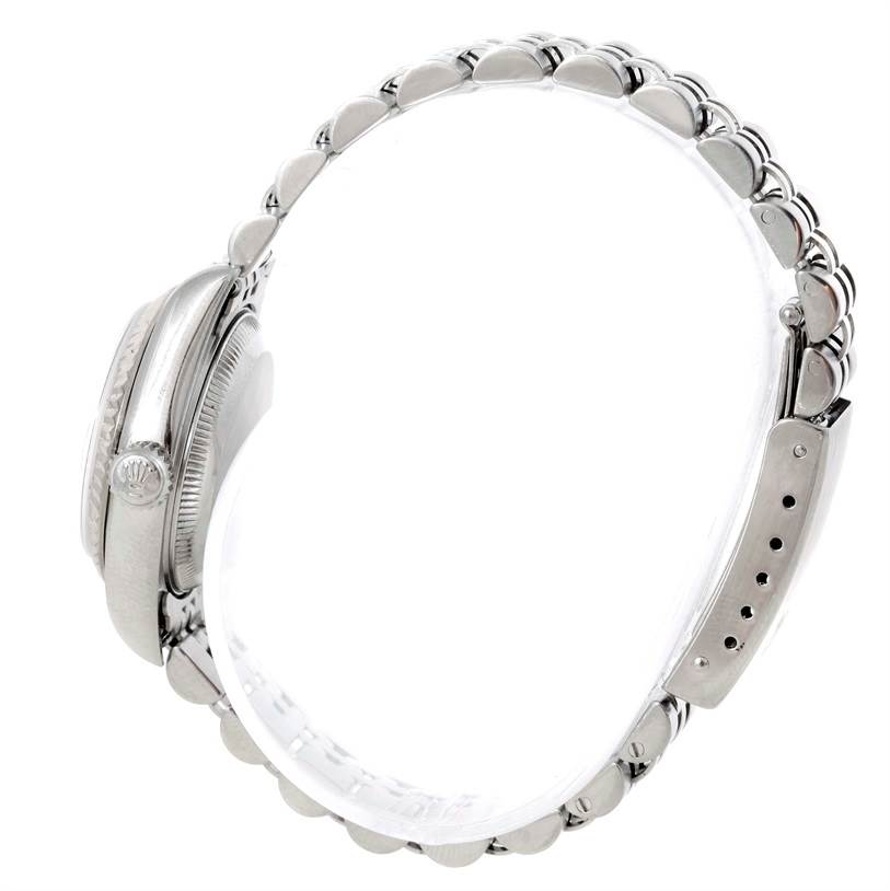 This photo shows a side view of the Rolex Datejust 79174 Women's Stainless Steel Blue Dial 79174 Women's Stainless Steel Blue Dial watch, focusing on the case and bracelet.