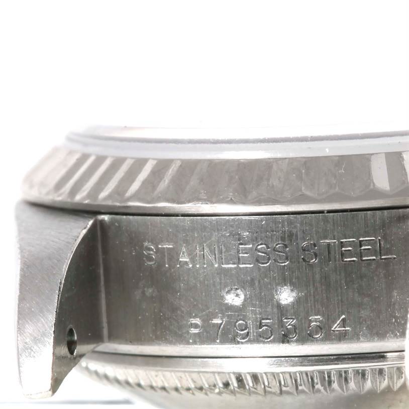 The image shows a close-up side view of the stainless steel case and bezel of a Rolex Datejust 79174 Women's Stainless Steel Silver Dial 79174 Women's Stainless Steel Silver Dial watch.