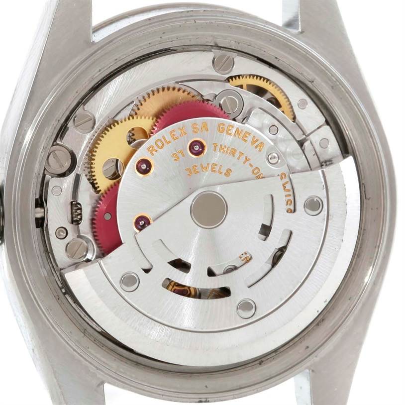 This image shows the movement mechanism of the Rolex Datejust 79174 Women's Stainless Steel Silver Dial 79174 Women's Stainless Steel Silver Dial watch from a back angle, highlighting the gears and rotor.