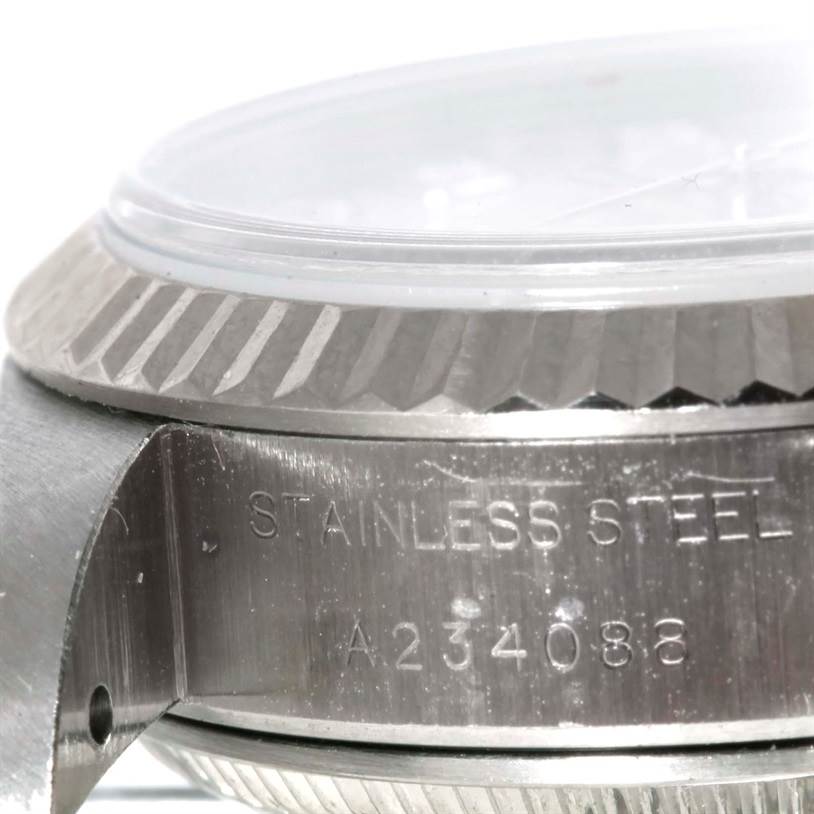 This image shows a close-up of the side of a Rolex Datejust 79174 Women's Stainless Steel Silver Dial 79174 Women's Stainless Steel Silver Dial watch, highlighting the stainless steel case and part of the bezel.