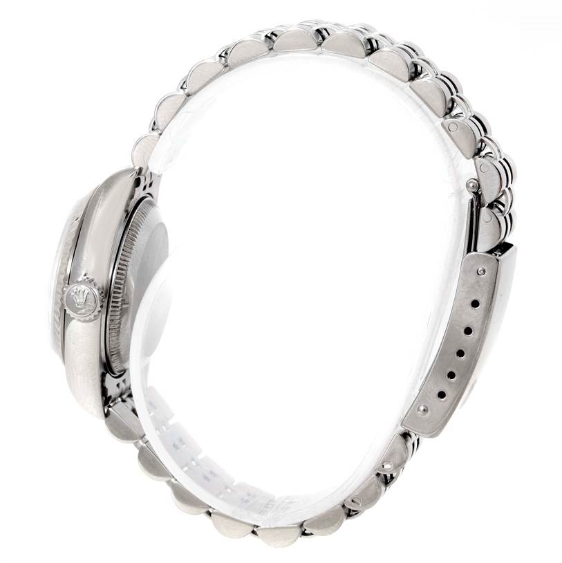 This image shows a side profile of a Rolex Datejust 79174 Women's Stainless Steel Silver Dial 79174 Women's Stainless Steel Silver Dial watch, highlighting its crown, case, and a partial view of the bracelet and clasp.