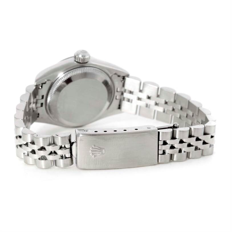 This image shows the back case and part of the metal bracelet of a Rolex Datejust 79174 Women's Stainless Steel Silver Dial 79174 Women's Stainless Steel Silver Dial watch.