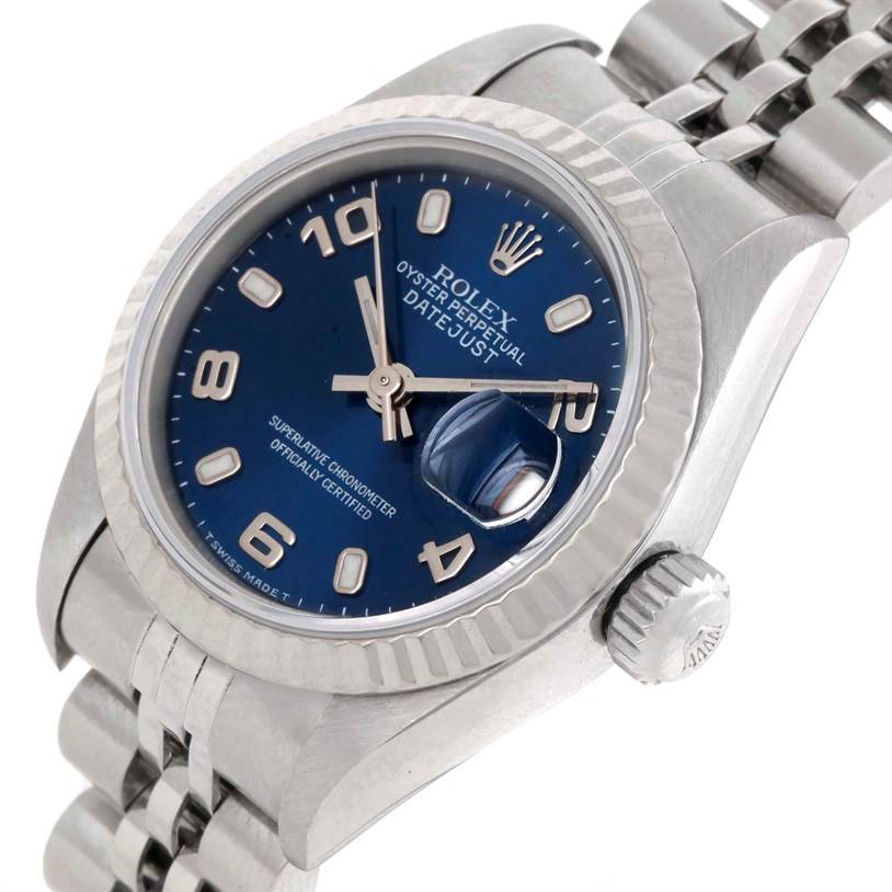 This image shows a close-up, angled view of a Rolex Datejust 69174 Women's Stainless Steel Blue Dial 69174 Women's Stainless Steel Blue Dial watch, highlighting the blue dial, fluted bezel, and jubilee bracelet.