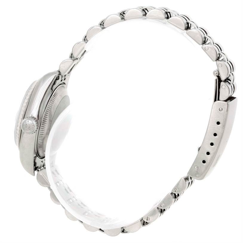 This is a side profile view of a Rolex Datejust 69174 Women's Stainless Steel Blue Dial 69174 Women's Stainless Steel Blue Dial watch, featuring the crown, case, and bracelet.