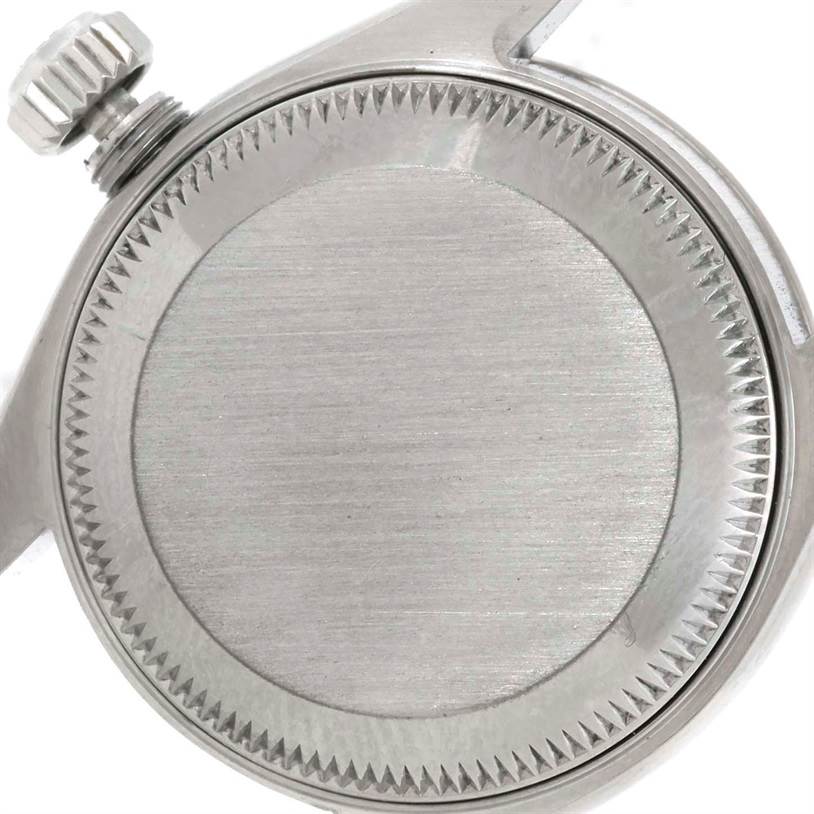This image shows the back of a Rolex Datejust 69174 Women's Stainless Steel Blue Dial 69174 Women's Stainless Steel Blue Dial watch, focusing on the case and crown from a close-up angle.