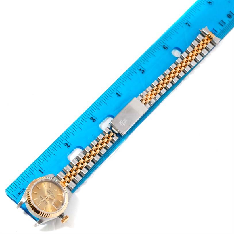 The image shows a Rolex Datejust 69173 Women's Stainless Steel Champagne Dial 69173 Women's Stainless Steel Champagne Dial watch laid out flat, with its face, bracelet, and clasp aligned next to a ruler for measurement.