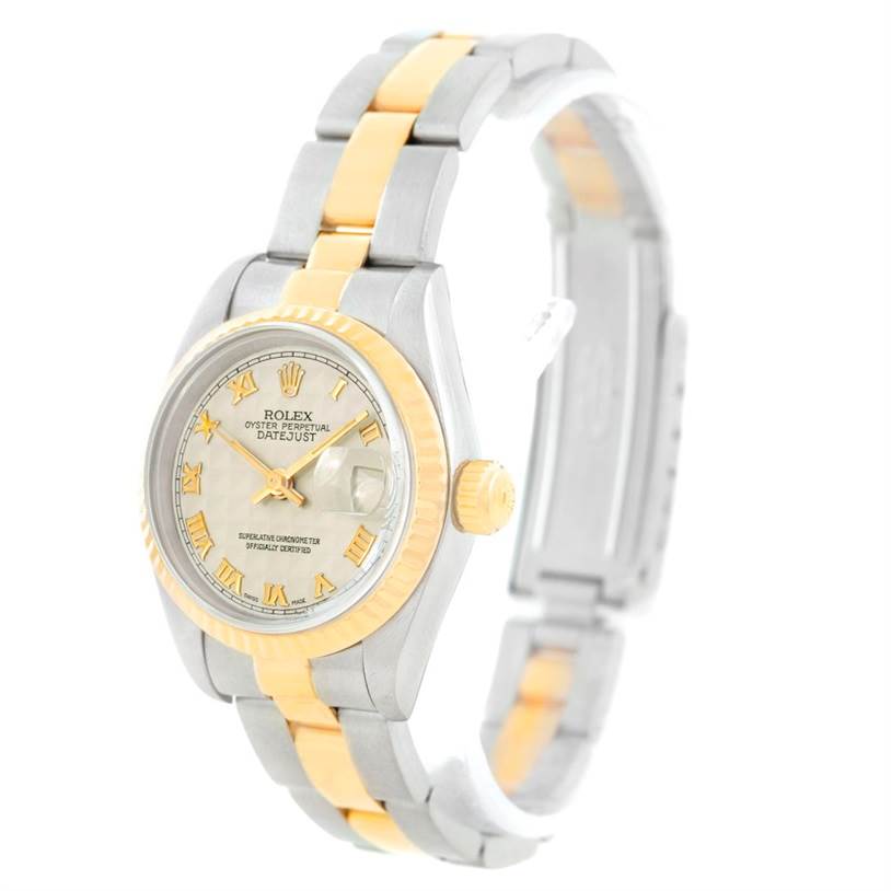 The Rolex Datejust 69173 Women's Stainless Steel Beige Dial 69173 Women's Stainless Steel Beige Dial watch is shown at a slight angle, displaying its face, bezel, crown, and two-tone bracelet.