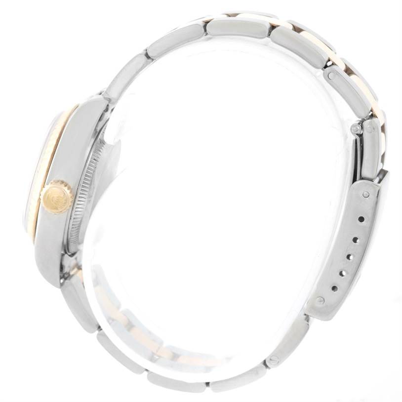 The image shows a Rolex Datejust 69173 Women's Stainless Steel Beige Dial 69173 Women's Stainless Steel Beige Dial watch from a side view, highlighting the crown and part of the bracelet.