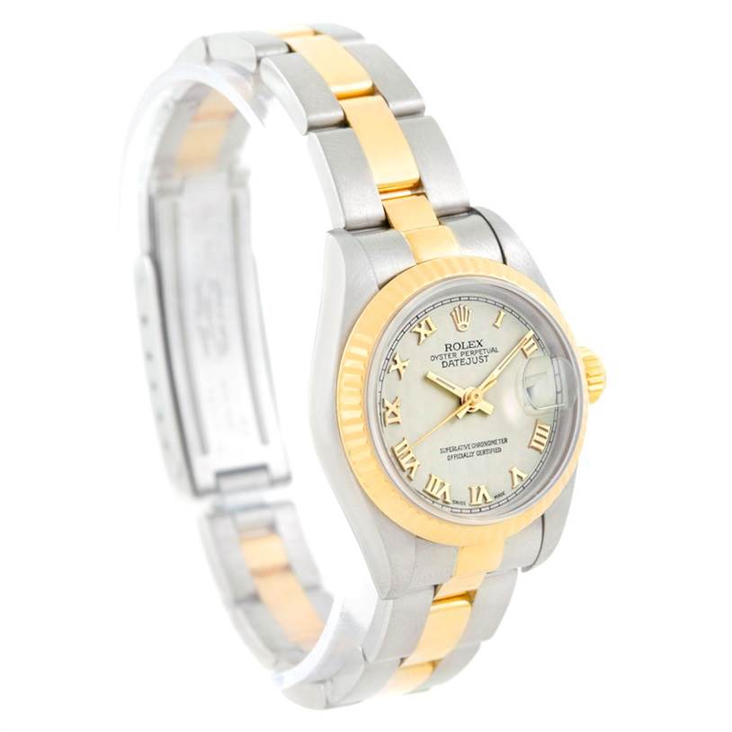 The Rolex Datejust 69173 Women's Stainless Steel Beige Dial 69173 Women's Stainless Steel Beige Dial watch is shown from a three-quarter angle displaying its two-tone band, bezel, and face with Roman numerals.