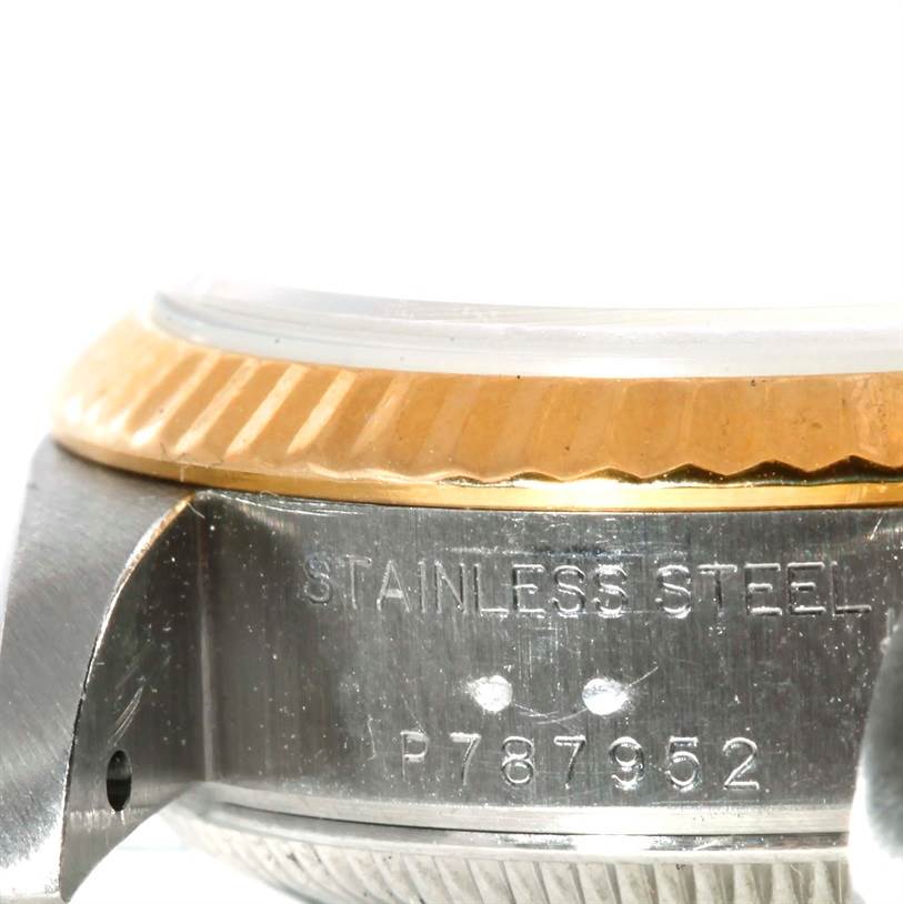 The image shows a close-up of the Rolex Datejust 79173 Women's Stainless Steel Silver Dial 79173 Women's Stainless Steel Silver Dial watch's side, focusing on the stainless steel case and the bezel.