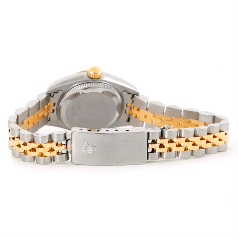 The image shows the back view of a Rolex Datejust 79173 Women's Stainless Steel Silver Dial 79173 Women's Stainless Steel Silver Dial watch, highlighting its case, crown, and two-tone bracelet with a clasp.