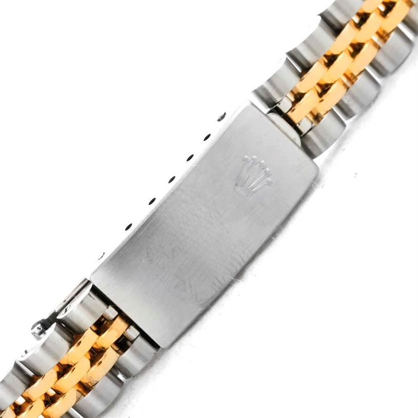 This image shows the clasp of a Rolex Datejust 69173 Women's Stainless Steel White Dial 69173 Women's Stainless Steel White Dial watch featuring a two-tone bracelet with the Rolex logo.