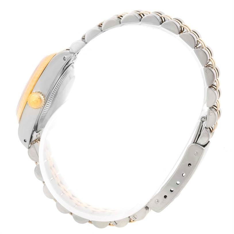 This image shows a side view of a Rolex Datejust 69173 Women's Stainless Steel White Dial 69173 Women's Stainless Steel White Dial watch, highlighting its bezel, crown, and bracelet.