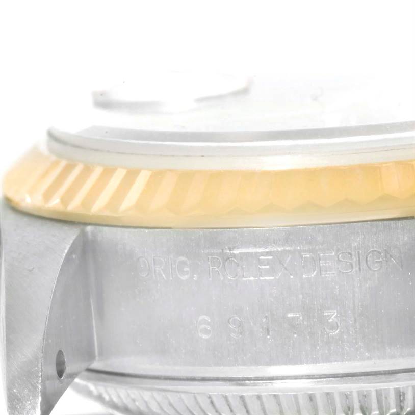 The image shows a close-up side angle of the case, bezel, and partially visible clasp of the Rolex Datejust 69173 Women
s Stainless Steel Champagne Dial 69173 Women
s Stainless Steel Champagne Dial watch.